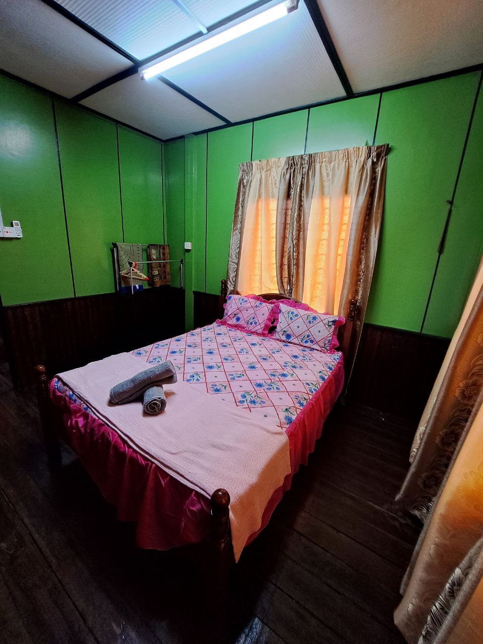 Queen bed, air conditioning, wardrobe space, hangers and towels prepared for guests