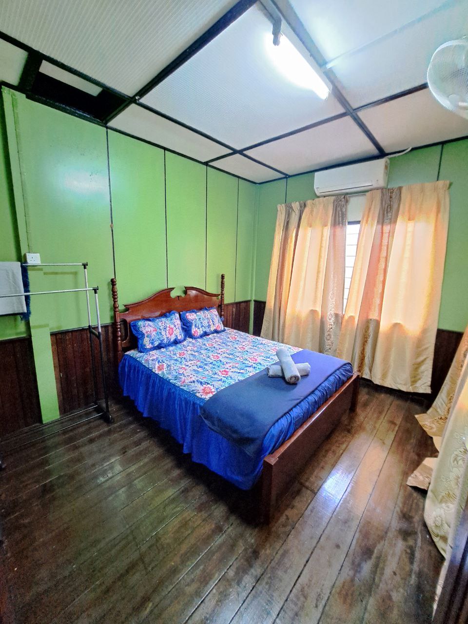 Queen bed, air conditioning, wardrobe space, hangers and towels prepared for guests