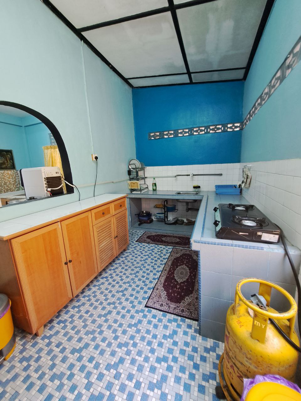 Kitchen and dining area with table, counter and appliances